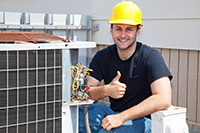 Spring Lake air conditioner repair technician giving thumbs up while finishing installation of new condenser